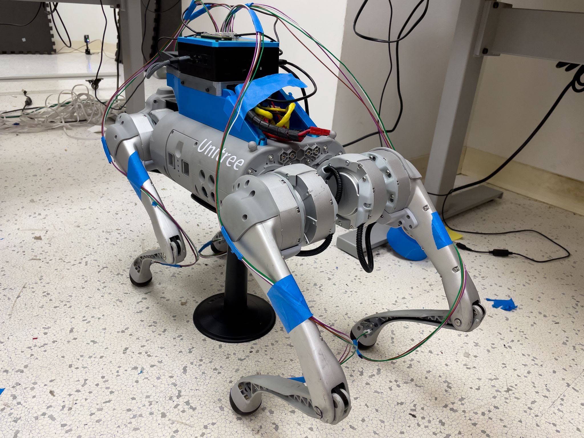 A quadruped robot with an IMU mounted on each calf